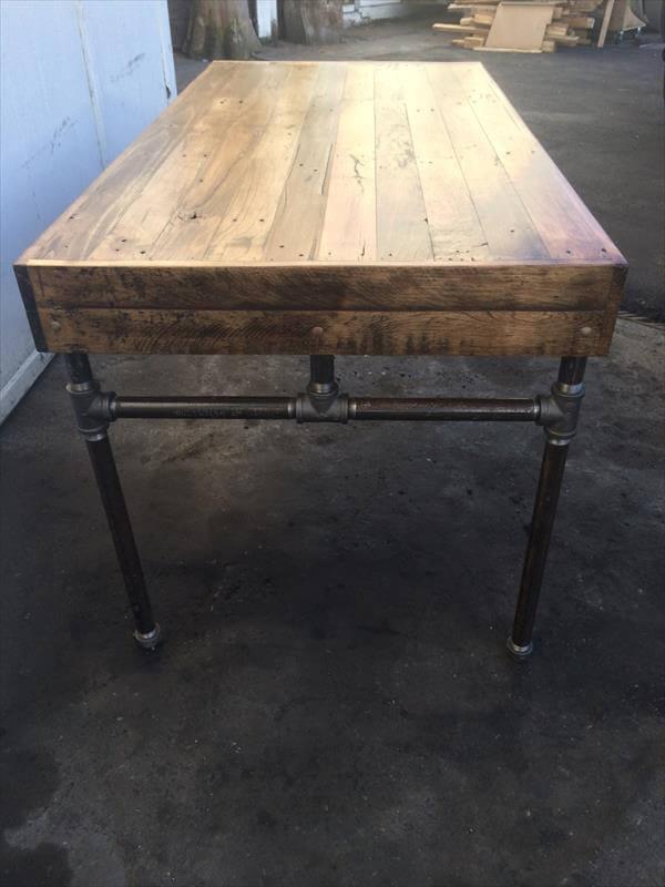 handmade pallet and iron pipe desk