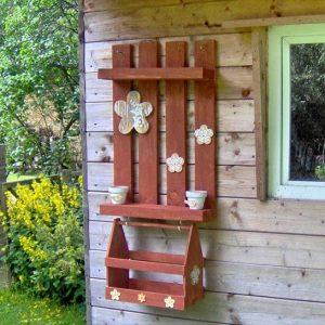 salvaged brick red garden wall rack with box