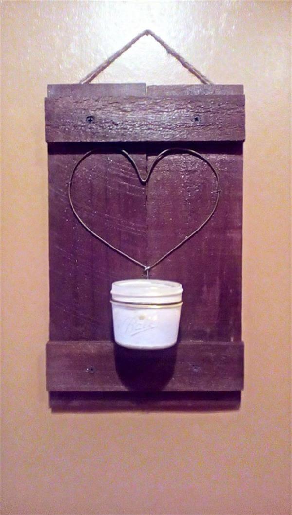 handcrafted pallet love wall art with candle light