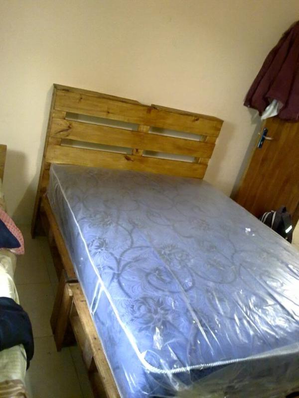 wooden pallet bed with headboard