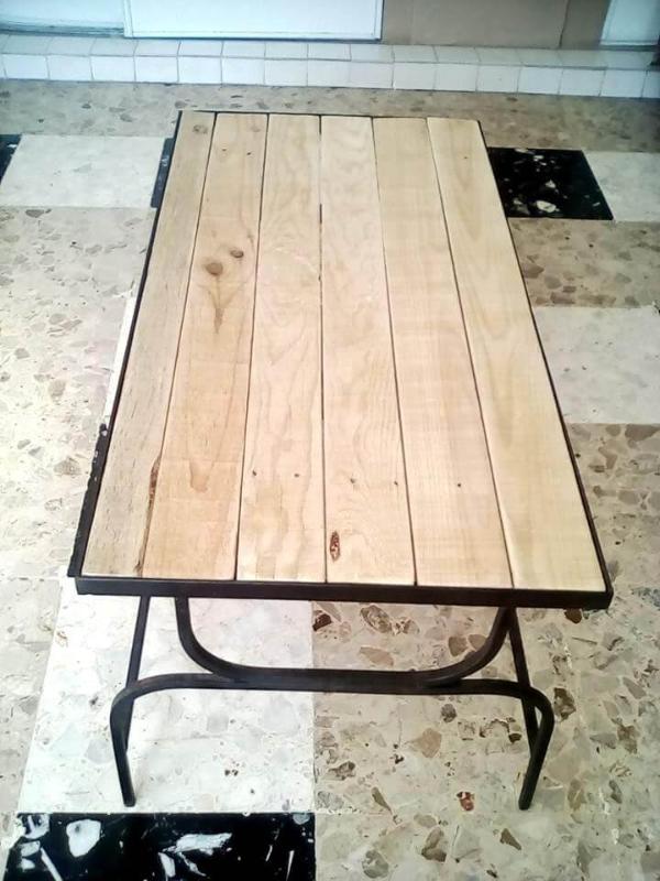 Wooden pallet coffee table with metal base