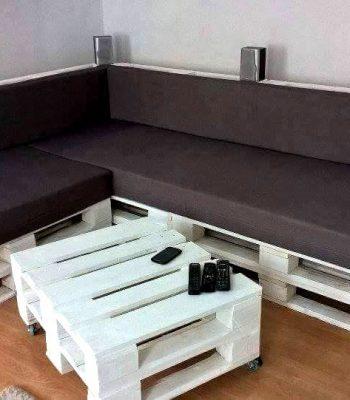 stack white painted pallet L-sofa with black cushion