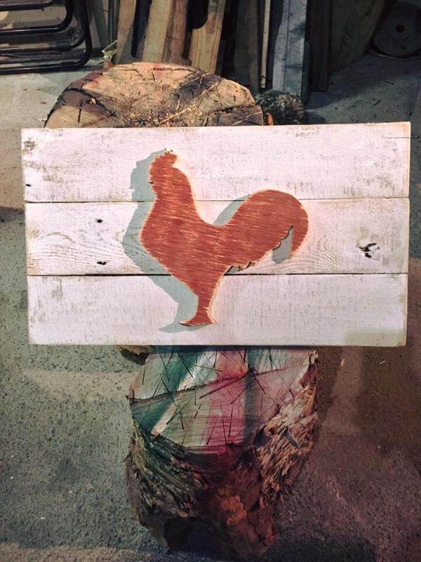 red painted wooden pallet cock wall art
