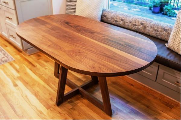 enhancing your space with oval dining tables